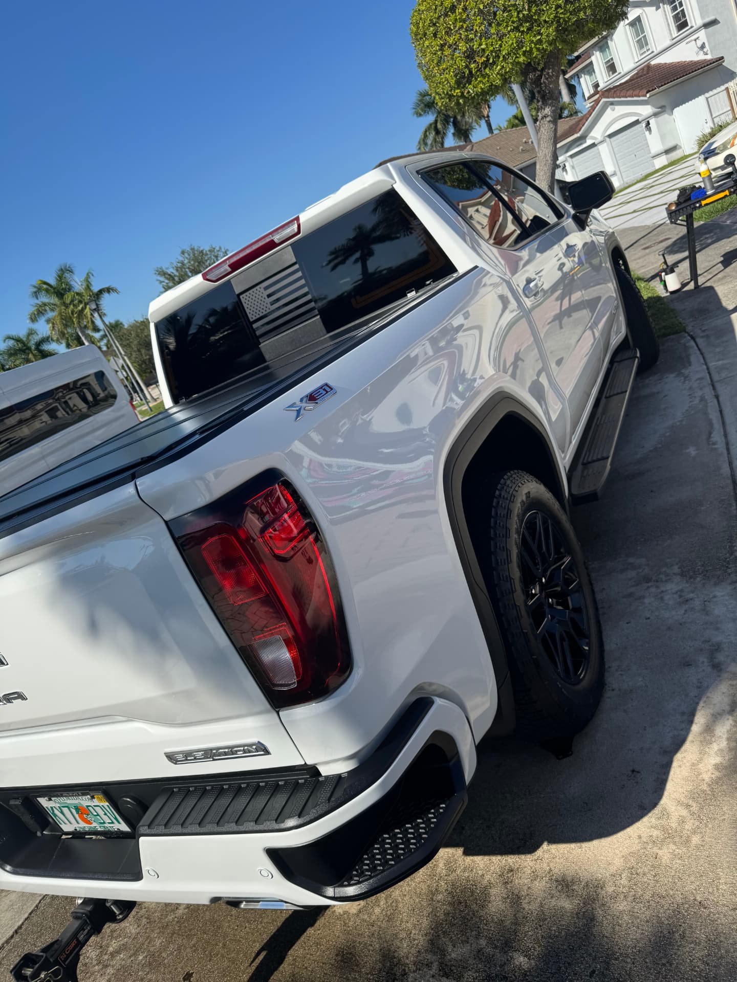 White pickup rear three-quarter, bed cover and paint finished